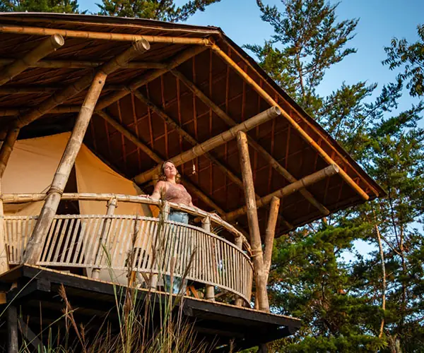 Glamping cabins surrounded by lush hills in Guatapé, Riverside partner destination in Colombia